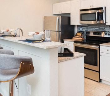Fully-equipped kitchens with granite countertops
